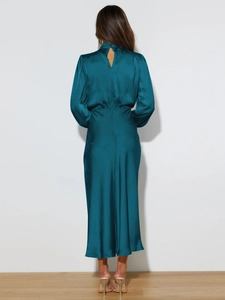 Detail of teal satin dress showing elegant back drop opening and smooth fabric texture
