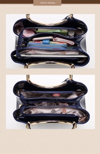 Detail view of navy blue patent leather bag interior showing multiple functional compartments