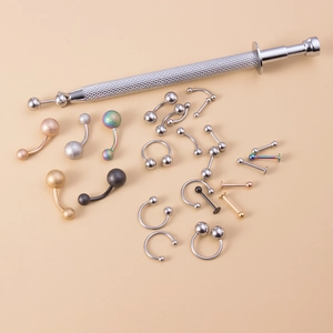 Versatile body piercing jewelry set with stainless steel beads and 4-claw grabber tool