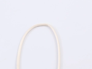 Detailed macro view of beige satin lace top straps with high-quality woven texture