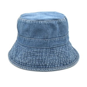 Detail of multi-row stitching on the brim of a dark blue washed denim bucket hat