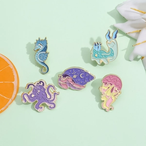 Cute pastel enamel pins set featuring seahorse, octopus, and jellyfish in sea animal design