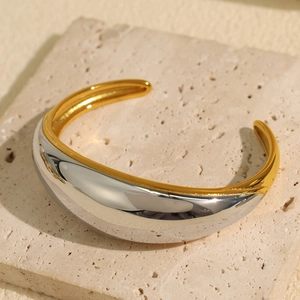 Exaggerated minimalist chunky C-shape open bangle in two-tone gold and silver finish