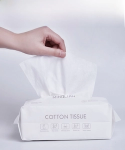 Detailed close-up of extra thick disposable facial towels made of natural cotton fibers
