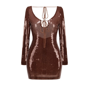 Detail view of deep brown sequin dress featuring open back ties and metallic texture