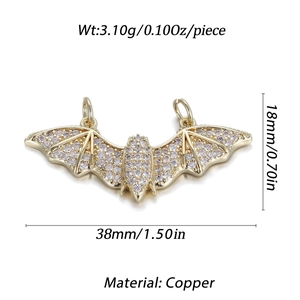Detailed view of a gold-plated copper bat pendant with zircon stones and size dimensions