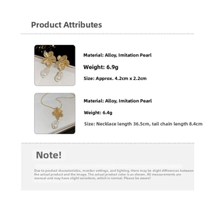 Detail view of vintage gold flower necklace and pearl earrings with specific size measurements