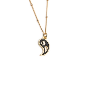 Gold plated copper necklace with black enamel Bagua Yin Yang pendant on white background