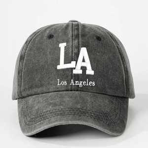 Detail of white LA Los Angeles embroidery on dark gray washed denim baseball cap