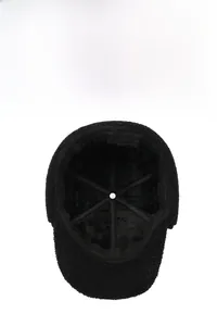 Close-up of thick black velvet lining inside a warm wool baseball cap for men