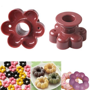 Brown plastic donut mold with colorful finished donuts in a high-quality product display