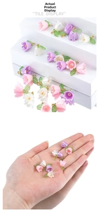 Detailed view of lily of the valley pendants for DIY jewelry making in various colors