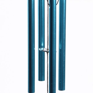 Detail view of blue aluminum tubes and silver striker of the metal wind chime