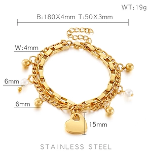 Vue détaillée du bracelet double couche doré avec cœur, mesures et fermoir mousqueton