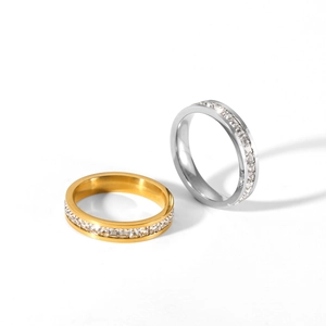 Detailed shot of gold and silver stainless steel rings with square-cut cubic zirconia