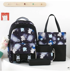Detailed four-piece student backpack set with blue star galaxy pattern and cartoon bear prints
