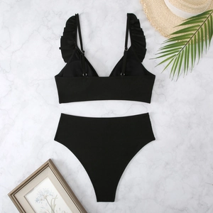 Close-up of ribbed texture and ruffled strap on black high waist bikini set