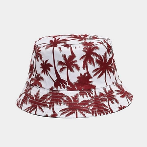 Detail of red palm tree print on a white cotton bucket hat with clean stitching