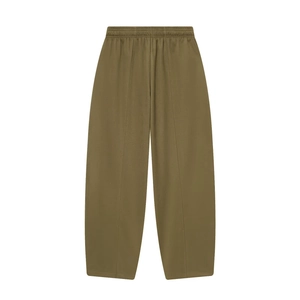 Detail of olive green wide-leg pants featuring elastic waistband and front seam design