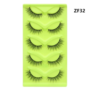 Detail view of 5 pairs of fox-eye cat-eye false eyelashes on a green tray, style ZF32