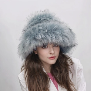 Detailed close-up showing the soft texture and fluffy faux fox fur of the light blue hat