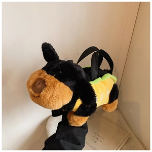 Detail of cute plush puppy handbag with long faux fur texture and green wavy trim accents