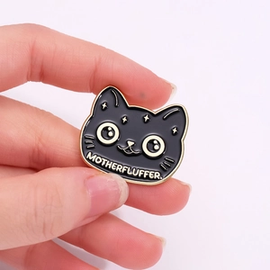 Halloween cartoon black cat enamel pin with golden stars and Motherfluffer text detail