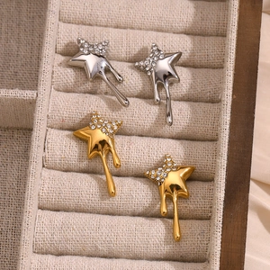 Star-shaped 18K gold plated tassel earrings with white zircon accents in jewelry box