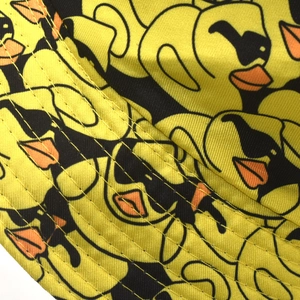 Detail shot of duck pattern print and precise double stitching on the canvas bucket hat