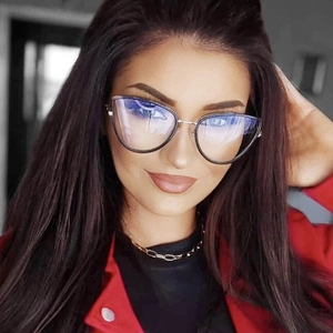 Close-up of model wearing black and silver metal cat-eye glasses with blue light coating