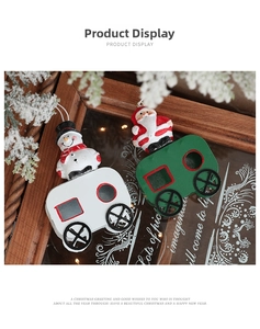 Detail of Santa Claus and Snowman on festive train carriage Christmas tree ornaments
