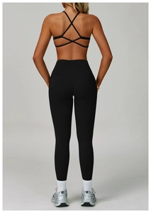 Detailed back view of criss-cross yoga sports bra and high-waisted leggings set