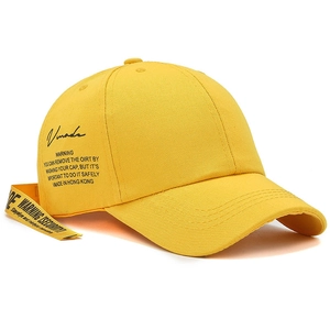 Bright yellow street style baseball cap with black Vmade script logo and long strap