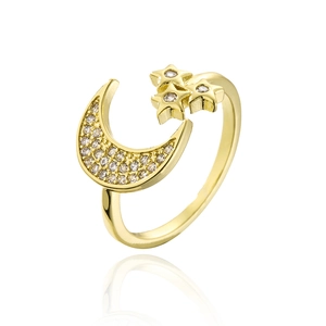 Macro detail of 18K gold plated moon and star open ring with sparkling zircon stones