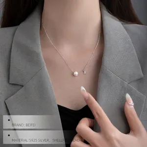 S925 silver necklace featuring round white shell pearl and micro-paved star pendant