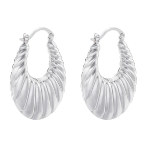 Macro detail of silver-plated C-shaped textured hoop earrings with a polished finish
