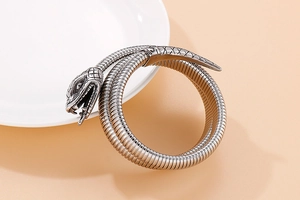 Detail of silver cobra snake wrap bracelet showing realistic scales and antique finish