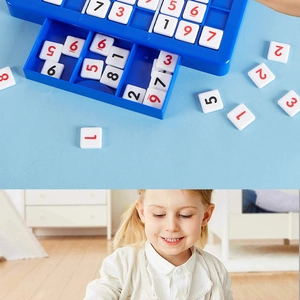 Detail of blue Sudoku puzzle board with magnetic number tiles and a child playing at home