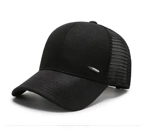 Close-up of black breathable mesh trucker hat featuring a premium metallic side logo