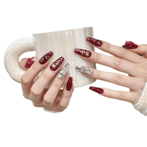Long coffin press-on nails with deep red wine color, gold dragon motifs and rhinestones