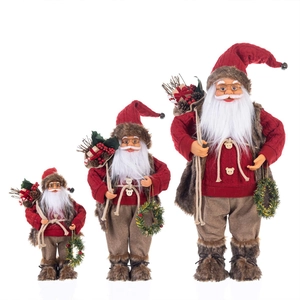 Christmas Santa figurines in red sweaters set of three sizes for holiday decoration