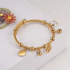 18K gold plated stainless steel wire bangle with cross charm and crystal pendant