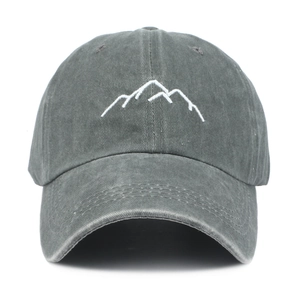 Detailed embroidery of white mountain lines on a charcoal grey washed cotton baseball cap