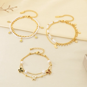 Golden double-layer bracelets with daisy, star-moon pendants and pearls in a set