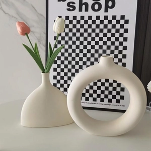 Modern Nordic matte cream white ceramic vase set featuring circular and teardrop designs