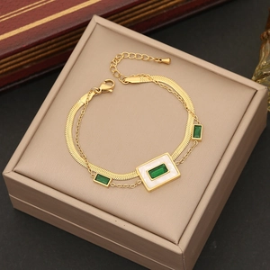 Double-layered gold stainless steel necklace with green emerald-cut pendant and white inlay