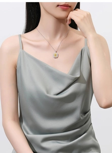 Detailed view of square yellow gemstone pendant with halo diamonds on S925 silver chain
