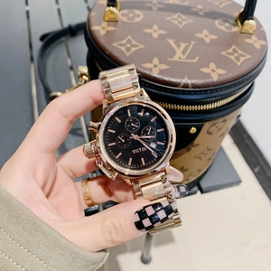 Women's gold stainless steel quartz watch with black dial and chronograph sub-dials