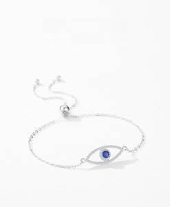 Detail of adjustable S925 sterling silver evil eye bracelet with pave zircon and blue stone