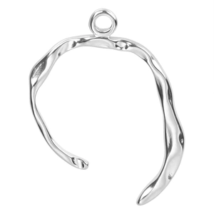 Macro detail of silver irregular organic fluid shape pendant for DIY jewelry making